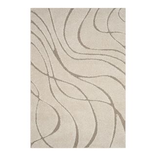 Cream colored rug with wave pattern