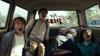 Jonathan Will and Mike scream with a bleeding man in the back of a van in Stranger Things 4