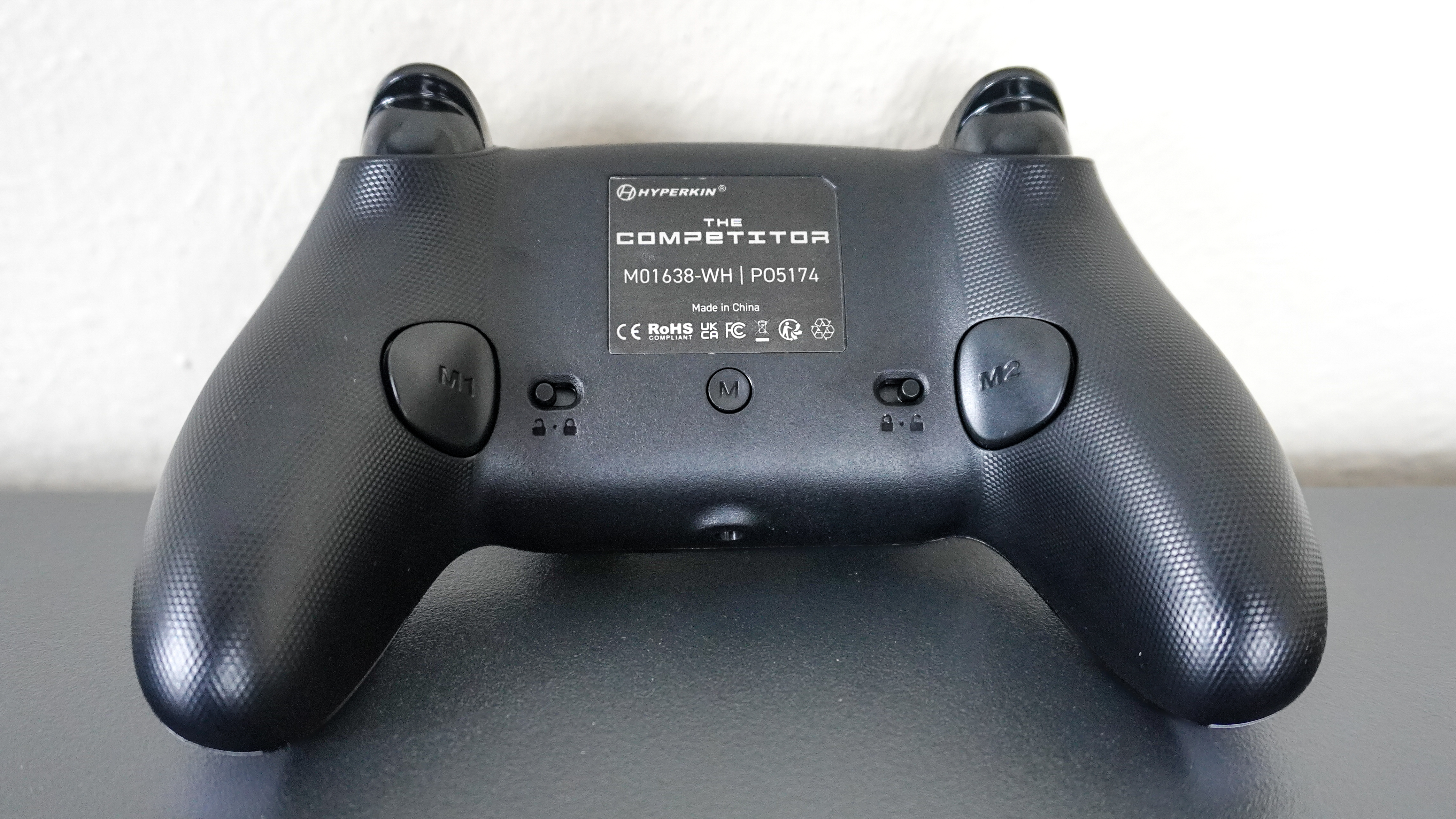 The remappable back buttons and trigger locks on the backside of the Hyperkin Competitor controller
