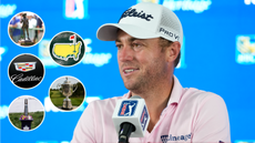 Justin Thomas chats in a press conference, with different Majors and Signature Event logos