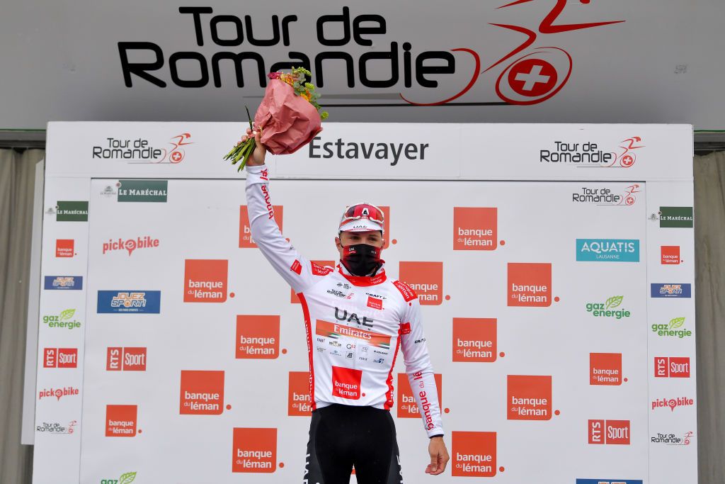 ESTAVAYER SWITZERLAND APRIL 30 Marc Hirschi of Switzerland and UAE Team Emirates white best young jersey celebrates at podium during the 74th Tour De Romandie 2021 Stage 3 a 1687km stage from Estavayer to Estavayer Mask Covid safety measures Flowers TDR2021 TDRnonstop UCIworldtour on April 30 2021 in Estavayer Switzerland Photo by Luc ClaessenGetty Images