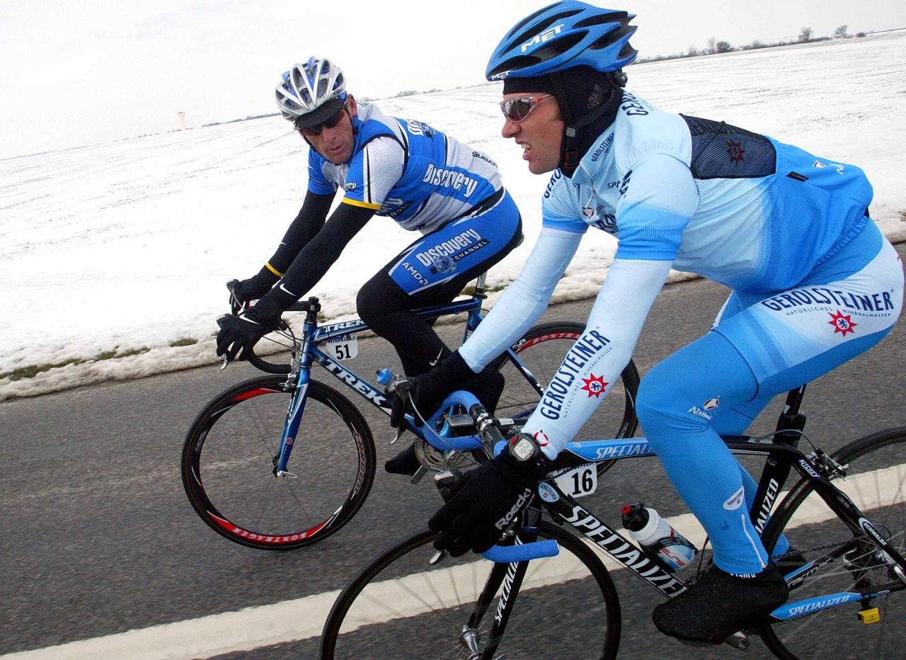 Lance Armstrong and Georg Totschnig on the cold road to Chabris, 2005.