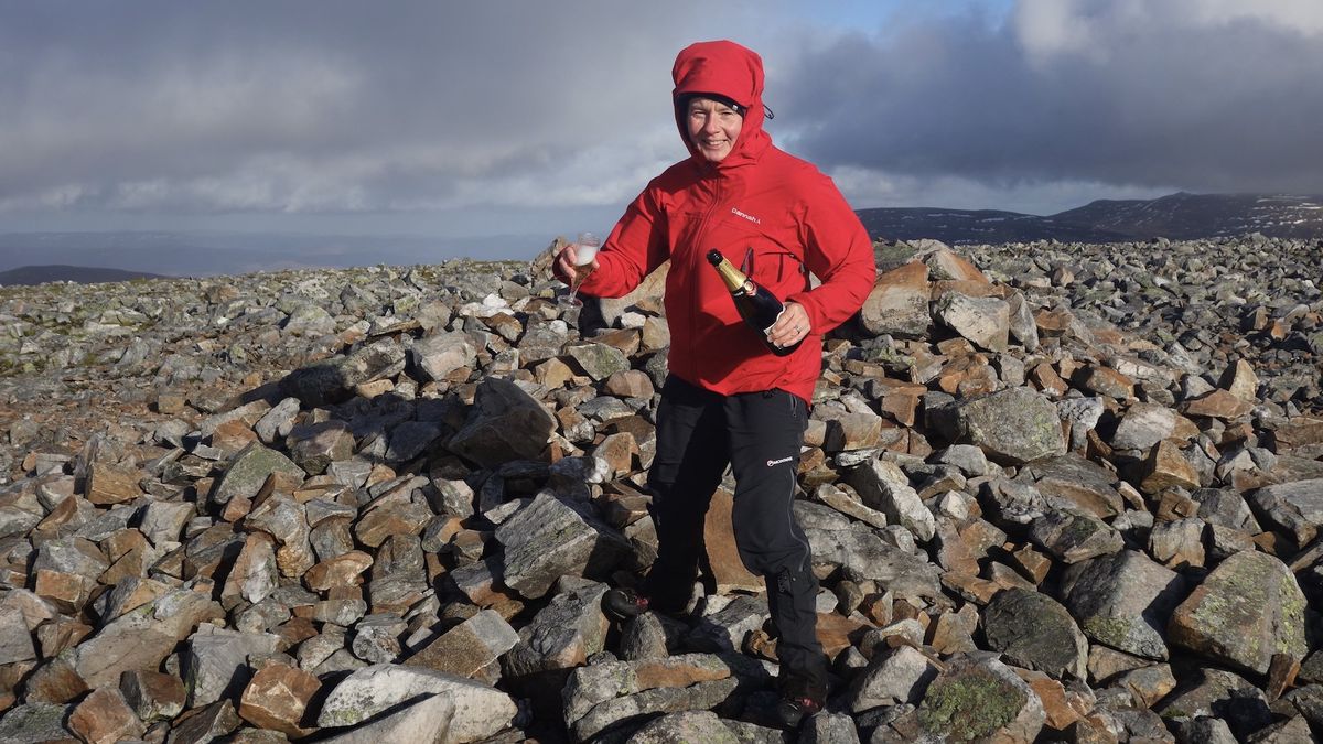 Hazel celebrates on a mountain