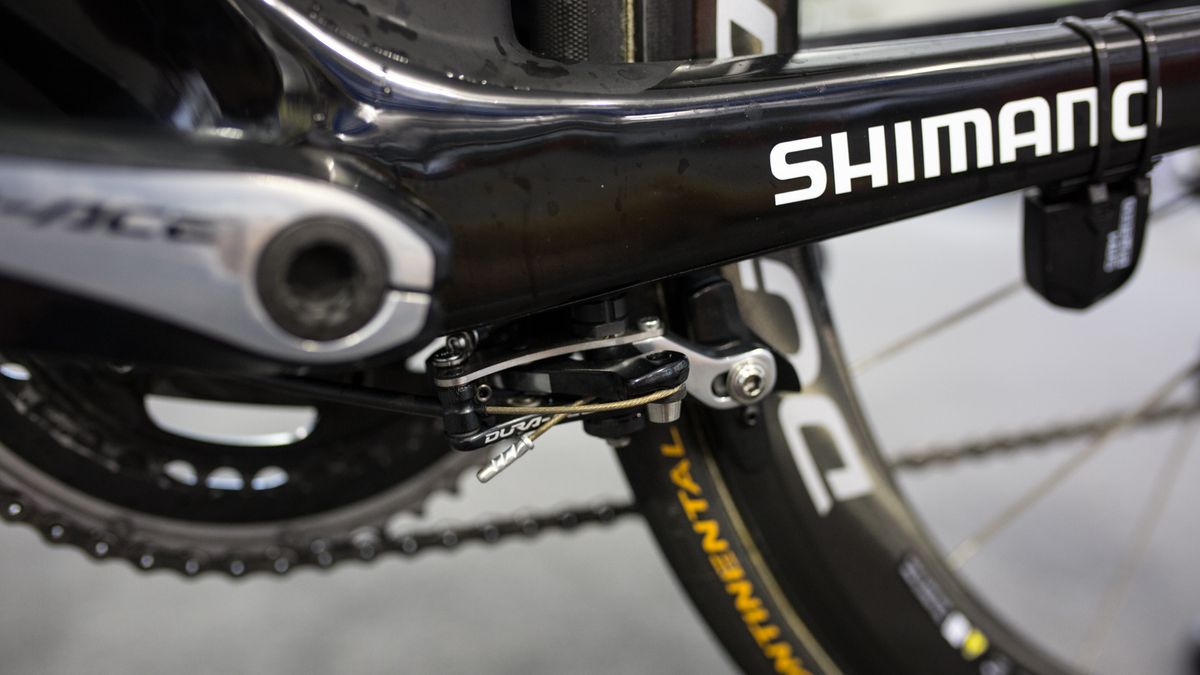 The rear brake is located underneath the bottom bracket