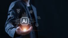 A businessperson holding a glowing AI symbol to represent them AI washing, selling a product on the false premise it's powered by AI.
