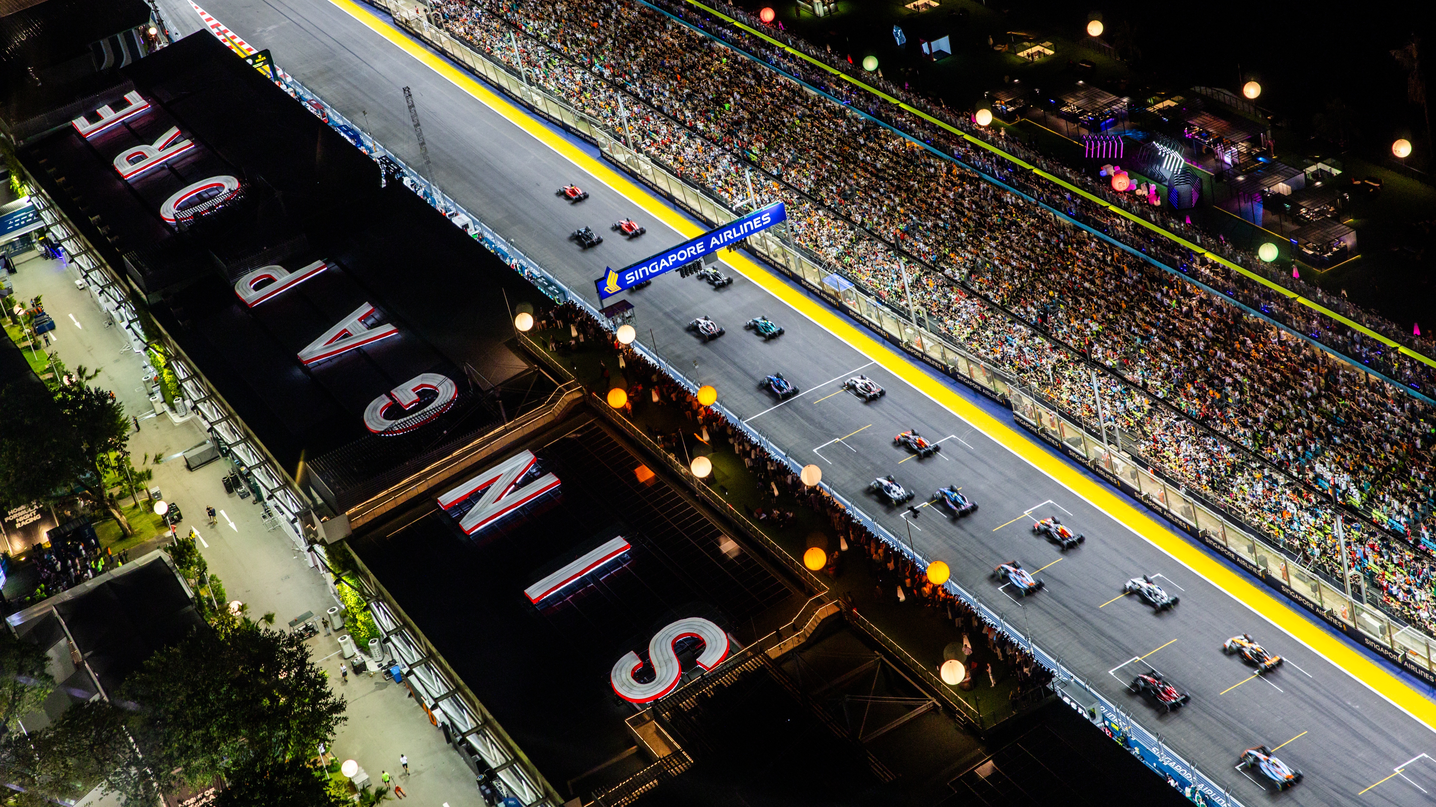 A general view as cars leave the grid at the start of the race during the F1 Grand Prix of Singapore at Marina Bay Street Circuit on September 17, 2023 in Singapore, Singapore.