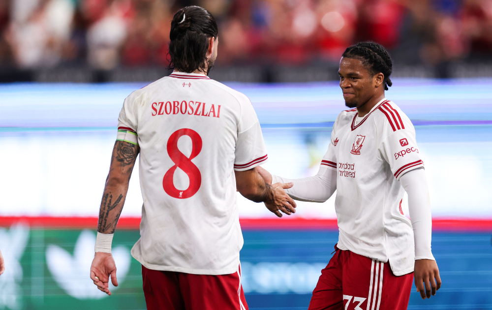 Rio Ngumoha #73 of Liverpool FC celebrates with teammate Dominik Szoboszlai #8 after scoring the team's first goal during the second half of the pre-season friendly against Wrexham
