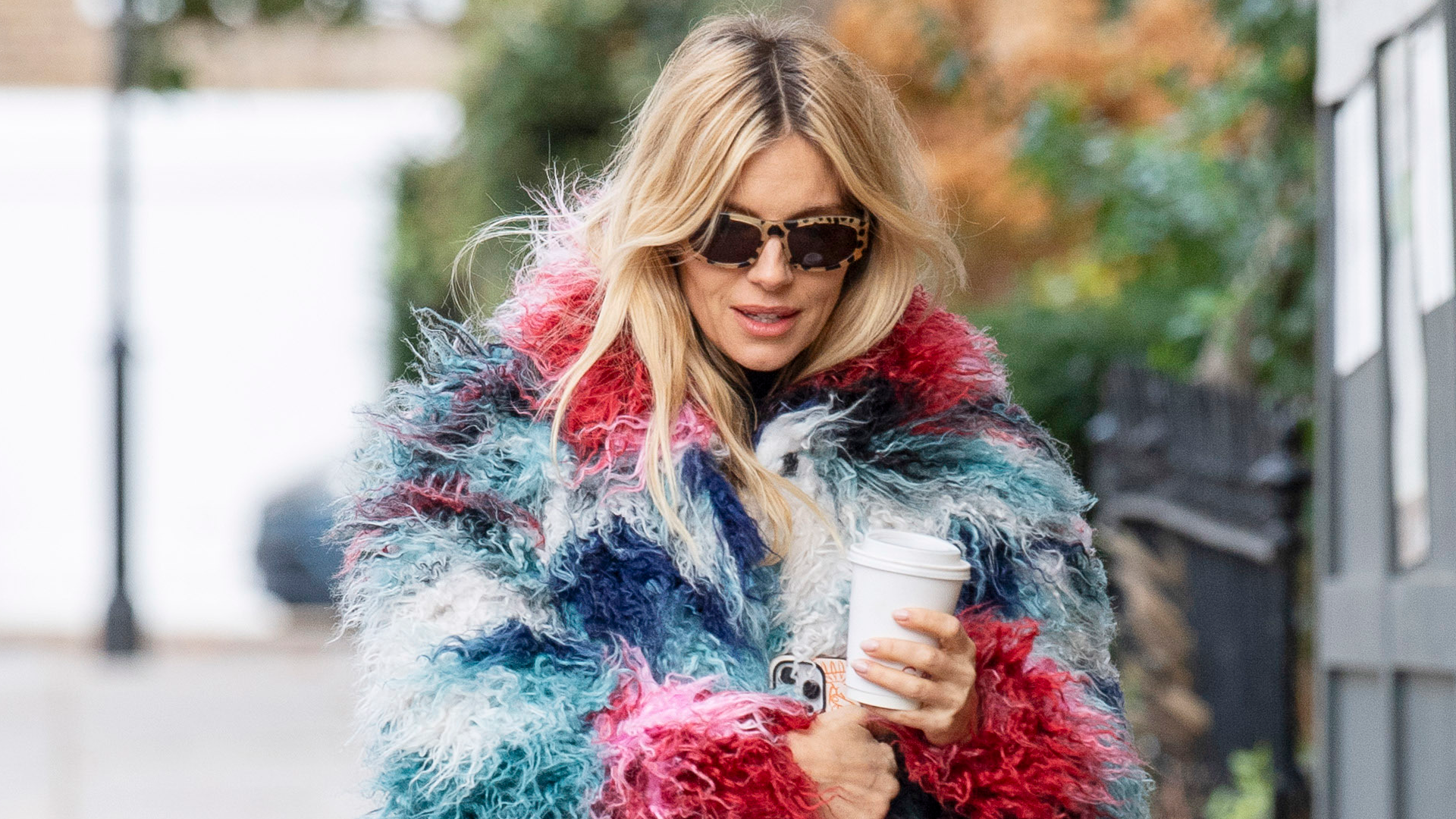 Sienna Miller was spotted in London wearing unseasonal white jeans and ballet flats