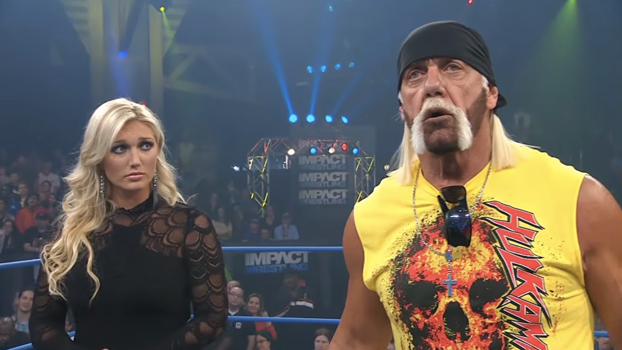 Brooke Hogan looking at Hulk Hogan in the ring while Bully Ray talks in TNA Wrestling