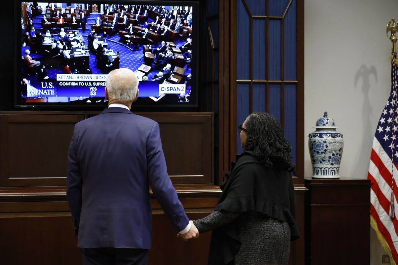 President Biden and Judge Ketanji Brown Jackson watch the Senate vote