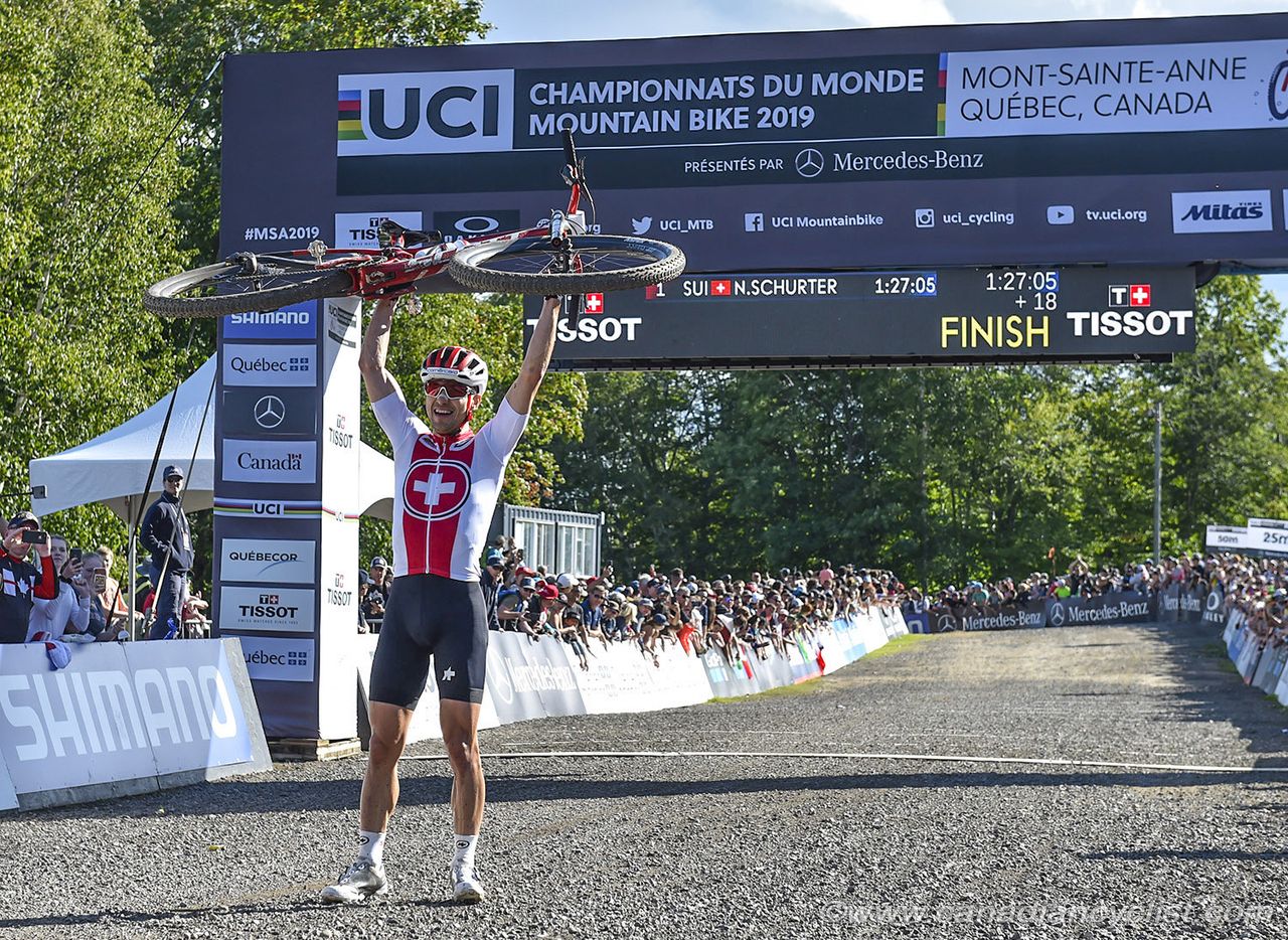 Schurter celebrates after crossing the line