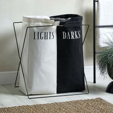 Dunelm Lights and Darks Laundry Bag inside bathroom bedside towel ladder and plant, with white wood flooring and jute rug