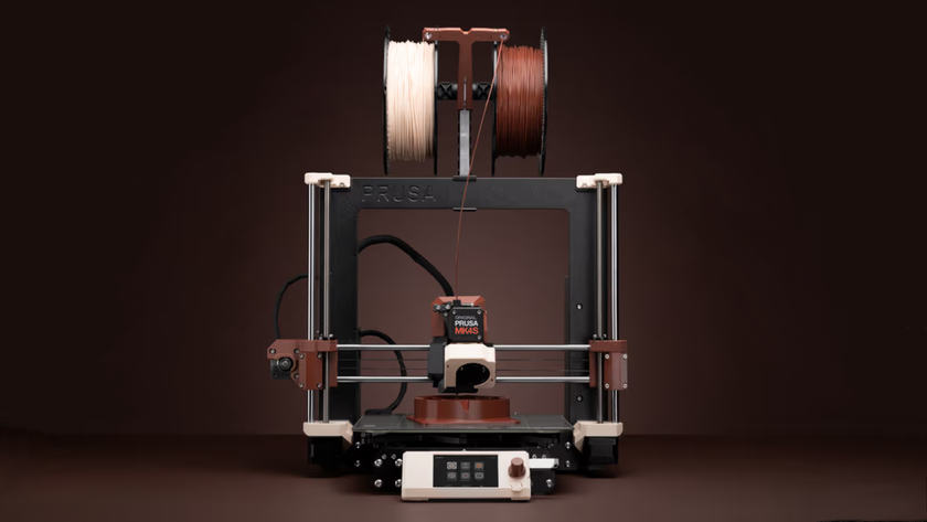 A 3D printer is shown using the new beige and brown 3D printing filaments from Noctua and Prusa Research.