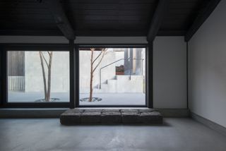 Zen room overlooking courtyard with two trees