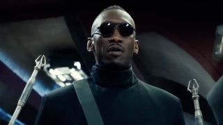 Mahershala Ali in dark shades and black outfit as he appears in Alita: Battle Angel.