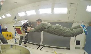 Scientists used a robotic gripper inspired by geckos to move cubes, cylinders and beach balls on the Weightless Wonder, NASA's aircraft that dives to create moments of zero gravity.