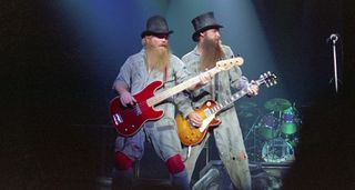 ZZ Top's Dusty Hill [left] and Billy Gibbons get their work clothes on as they perform live in 1981.
