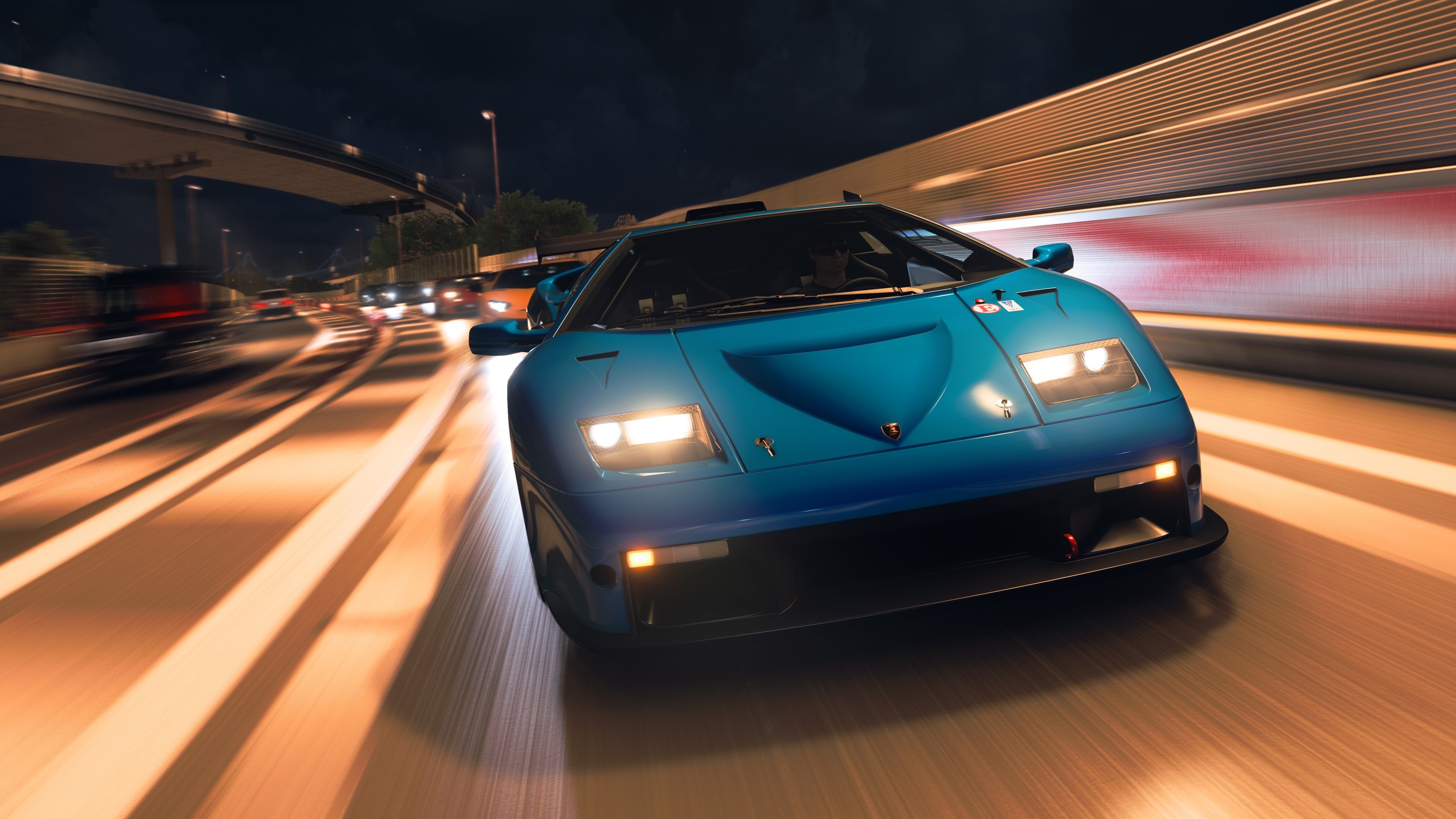 An official screenshot of a nighttime highway race in Forza Horizon 6.