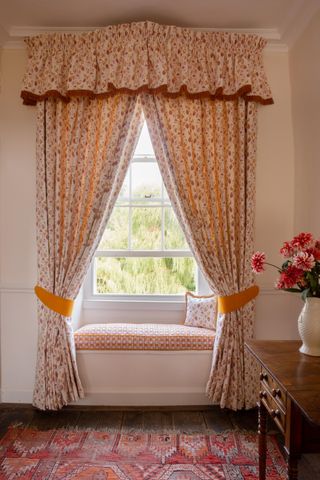 floral curtains and valance with tie backs in off white room