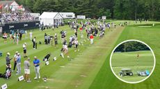 Golfers hit golf balls on the range, while a golf ball robot picks up golf balls