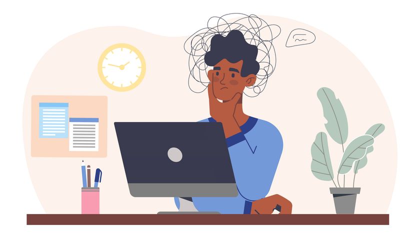 Illustration of a confused young man sat at a desk and using a computer