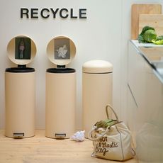cylindrical bin in kitchen to store kitchen waste