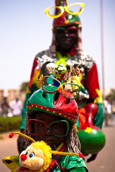 Two generations of crazed Burkina Faso sports fans.