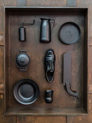Dark objects in a wooden drawer