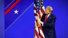 Donald Trump kisses a flag