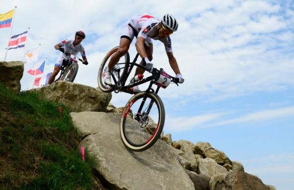 Nino Schurter (Switzerland) speeds through a rock garden
