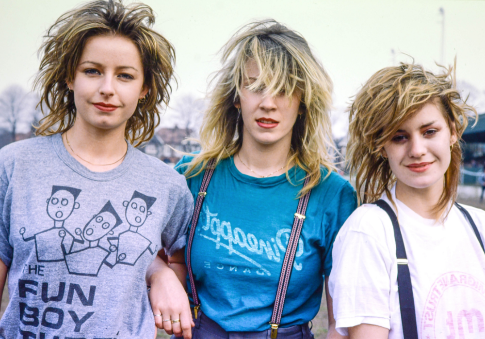 1980s Fashion: Bananarama group members wearing pastel coloured clothing with tousled hair