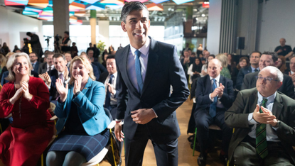 Rishi Sunak arrives to applause to deliver his first speech on 2023