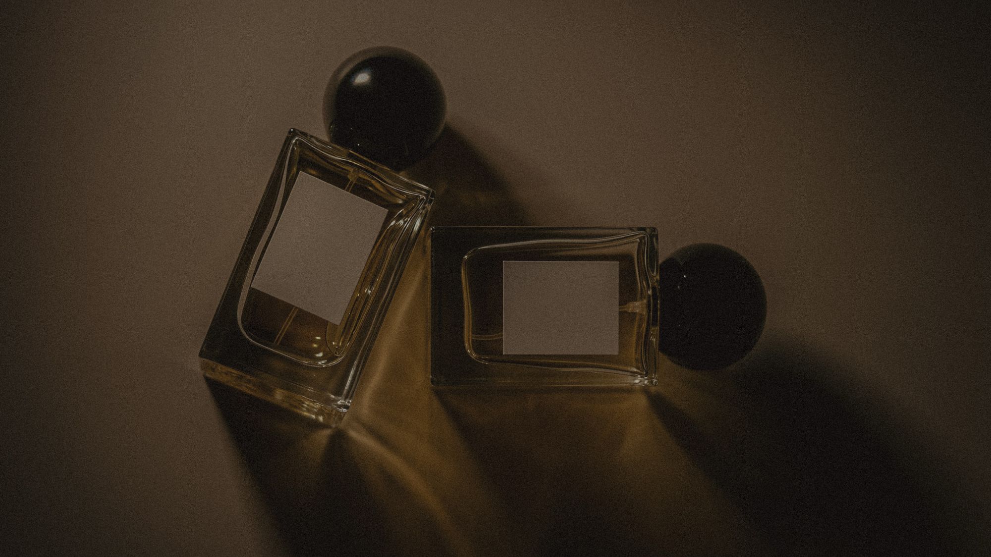 An image of two unlabeled perfume bottles.