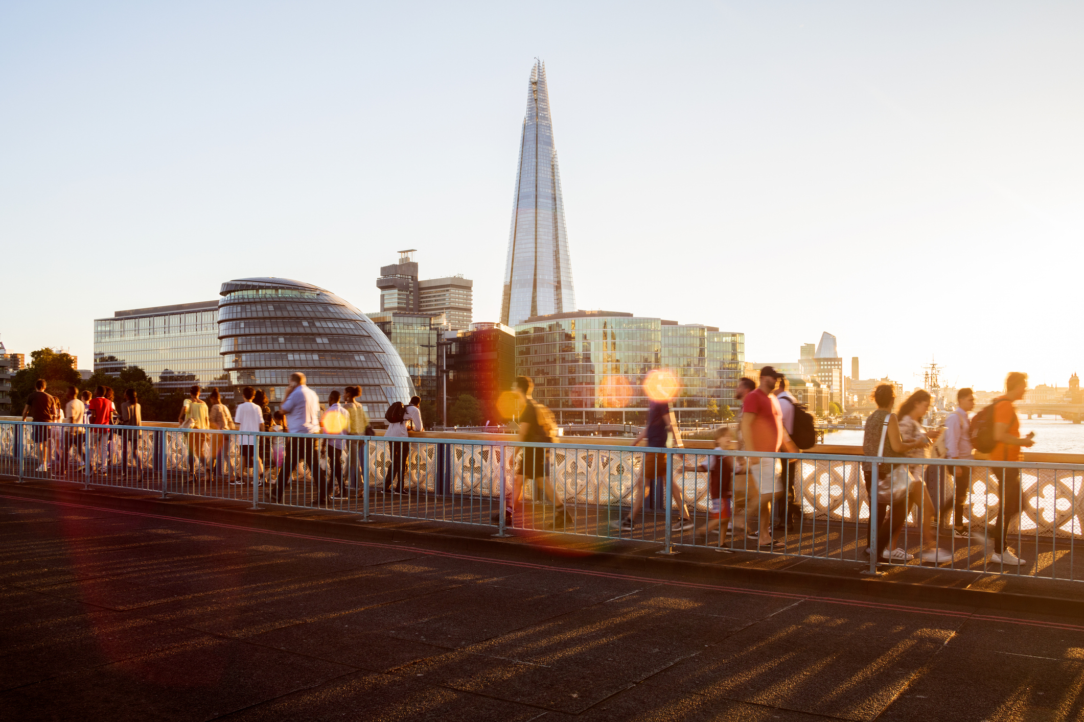 UK, London, view of City Hall and the Shard from Tower Bridge with crowd of unrecognisable people