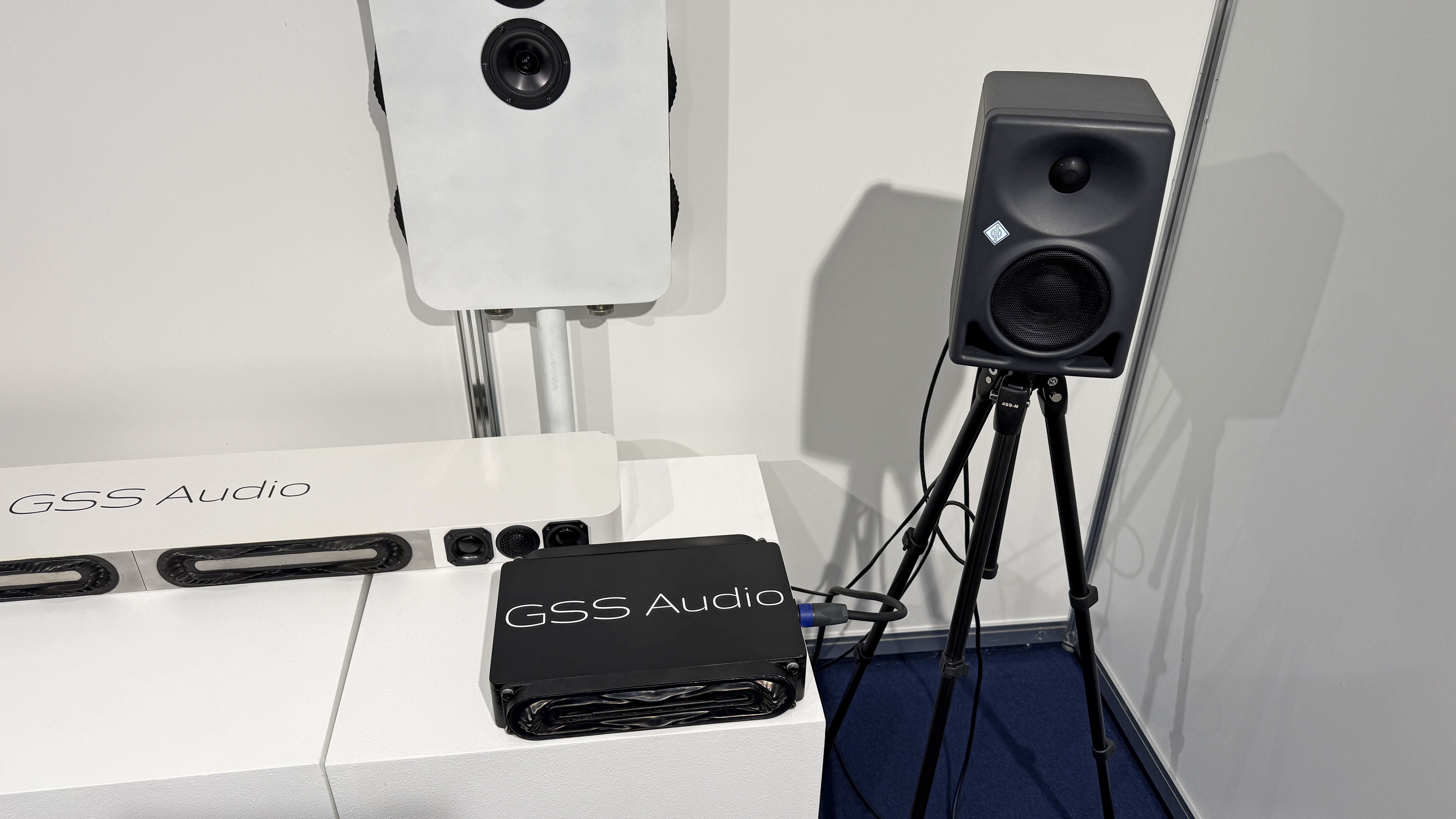 The GSS Model 1 transducer subwoofer prototype in front of a Neumann studio monitor speaker
