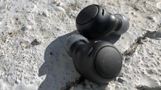 a closeup of the sony wf-c500 earbuds