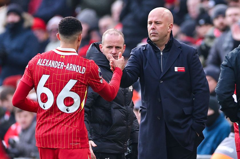 LIVERPOOL, ENGLAND - FEBRUARY 16: Arne Slot manager / head coach of Liverpool and Trent Alexander-Arnold of Liverpool during the Premier League match between Liverpool FC and Wolverhampton Wanderers FC at Anfield on February 16, 2025 in Liverpool, England. (Photo by Robbie Jay Barratt - AMA/Getty Images)