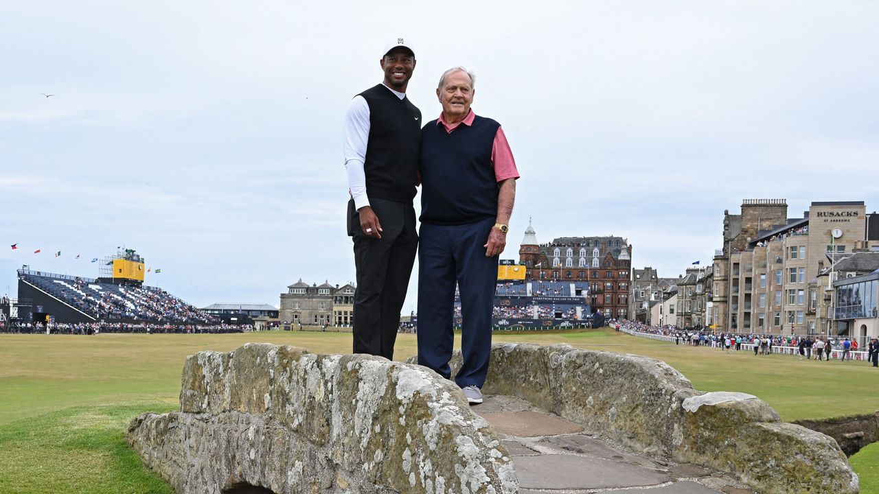 Tiger Woods and Jack Nicklaus pose on the Swilcan Bridge