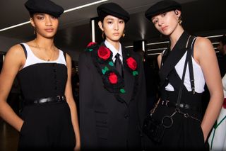 three models wearing cap at Fashion Week Women’s at Milan by Dolce & Gabbana