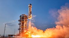 A New Shepard rocket and capsule blast off from Blue Origin's launch site in West Texas.