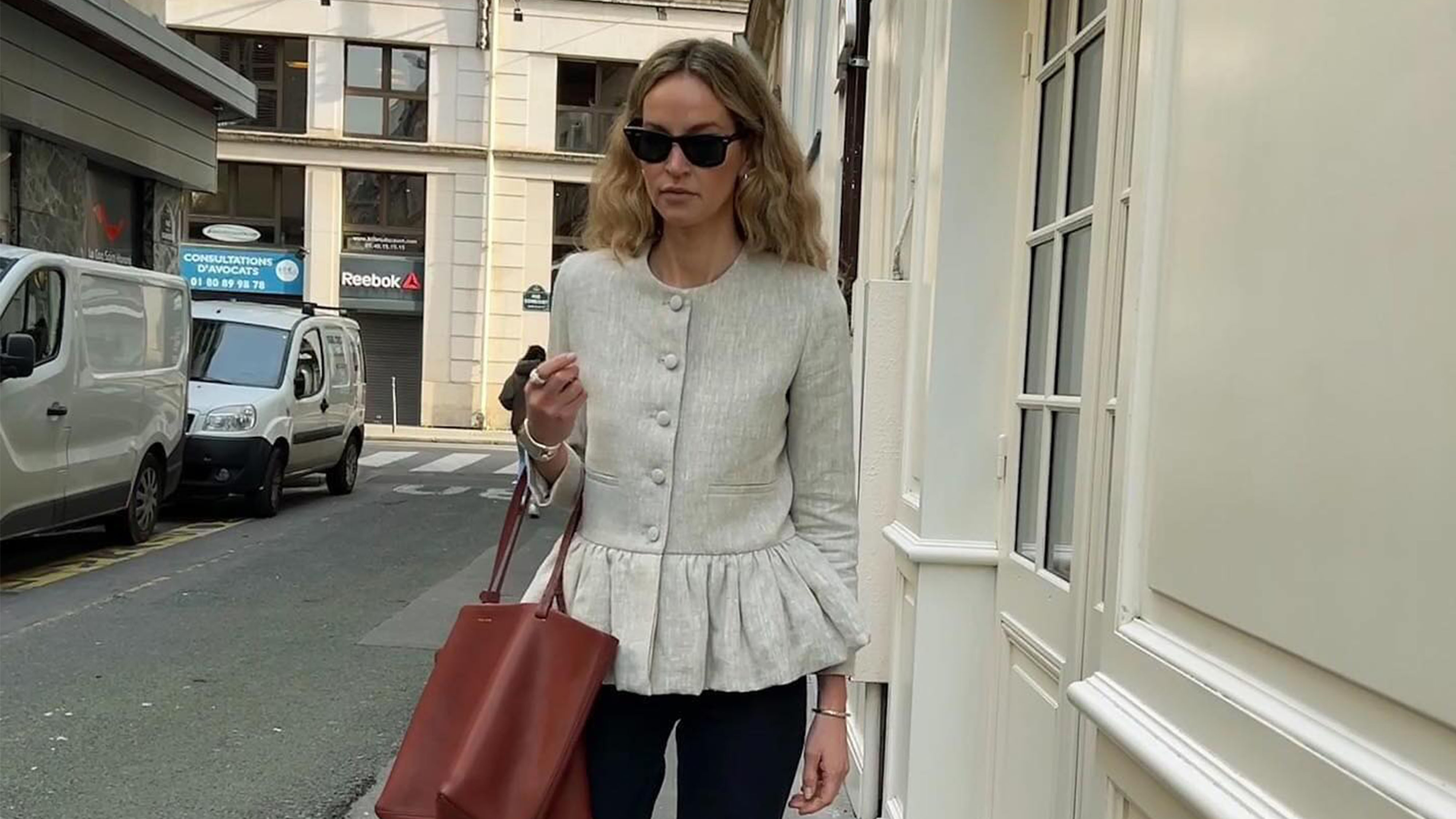 Woman wearing a peplum jacket outfit.