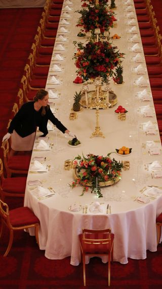Staff preparing for a banquet at Buckingham Palace