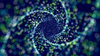 Spirals of bright green and purple particles swirl clockwise over a navy blue background