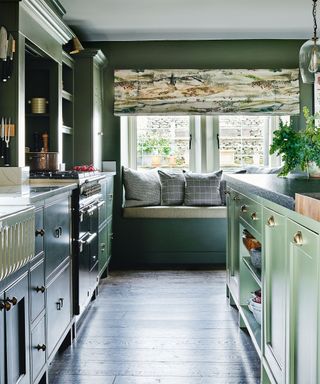 Green kitchen with windowseat and island