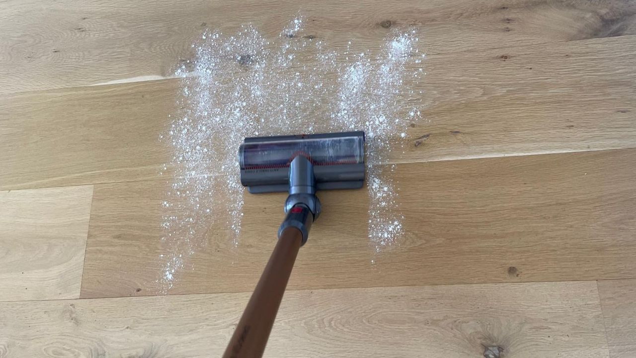 Dyson V15 vacuuming flour