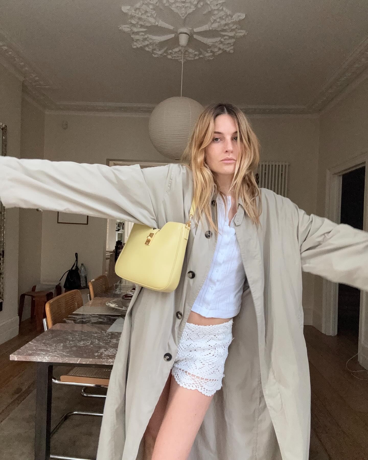 French woman wearing a butter yellow bag.