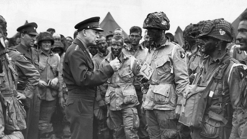 Dwight D. Eisenhower Talking to Paratroopers(Original Caption) 6/9/1944 - England - General Dwight D. Eisenhower, Supreme Commander of the Allied Expeditionary Forces, gives the order of the day "Full Victory--Nothing Else" to paratroopers somewhere in England. These first assault troops, faces blackened, boarded their planes immeditately after for the flight across the Channel.