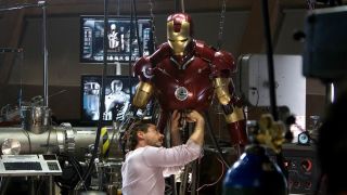 Tony Stark repairs one of his suits in Iron Man.
