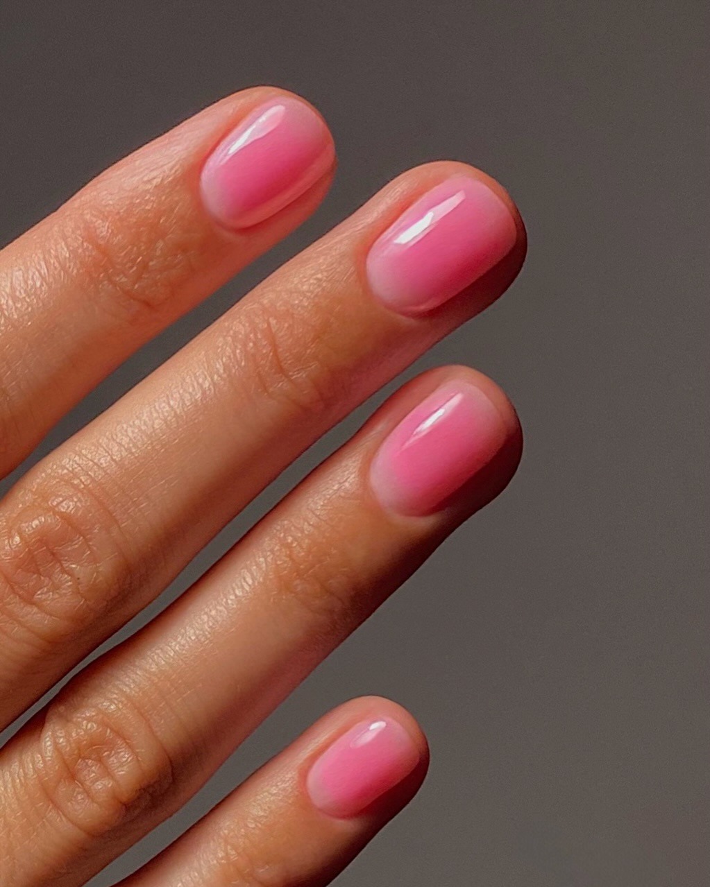 A side angle of the pink aura nails