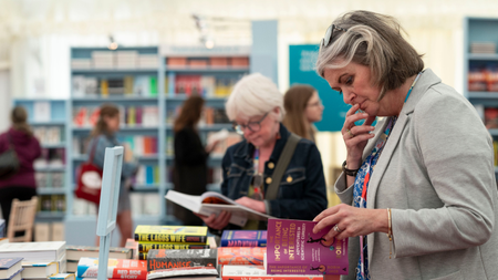 Woman browsing books at Hay Festival